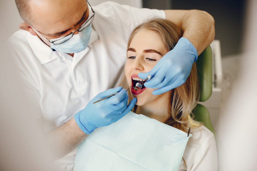 Beautiful lady in the dentist's office. Woman in a uniform